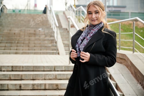 Preview: Photo Of A Fashionable Blonde Girl In A Coat On The Stairs Outdoors In The Spring City