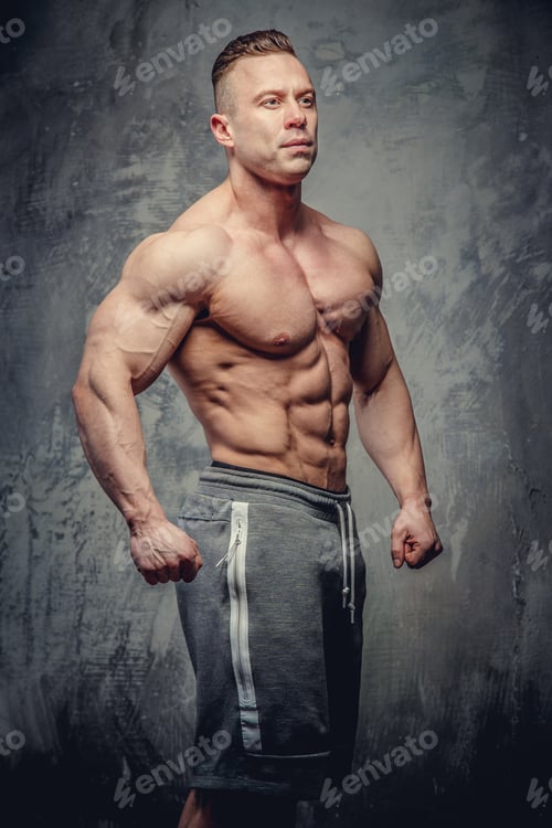 Preview: Big muscular man in grey shorts
