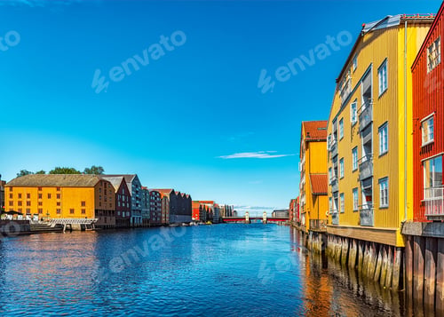 Preview: Beautiful view along the Nidelva River with a number of historic warehouses in Trondheim, Norway