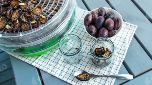 Preview: Plums dried in a dehydrator. Selective focus.