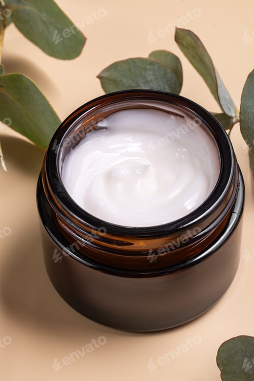 Preview: face cream on beige background. Dry eucalyptus leaves decoration. Professional bottle for facial