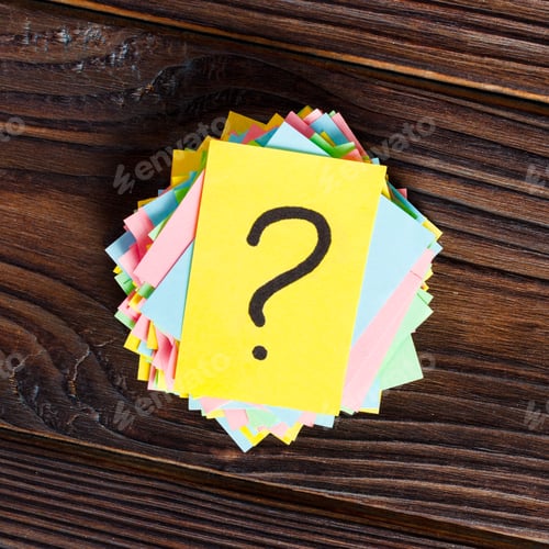 Preview: colorful question marks written reminders tickets on wooden background