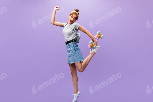 Preview: Teenage Girl with backpack running and holding longboard. Lovely woman with yellow headband posing