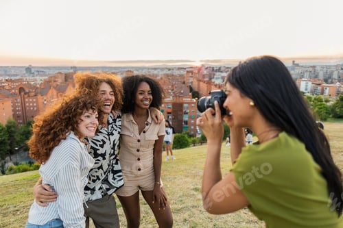 Preview: Diverse friends enjoying outdoor leisure and photography together