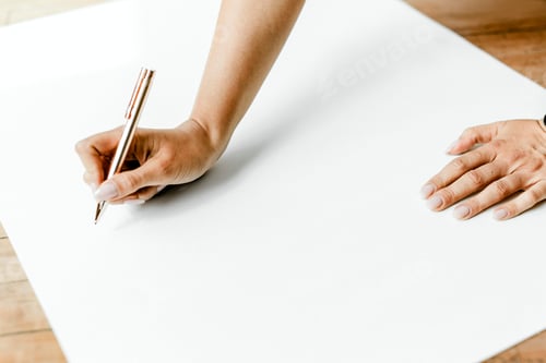 Preview: Businesswoman writing on a paper