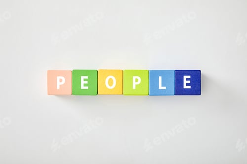 Preview: top view of people lettering made of multicolored cubes on white background