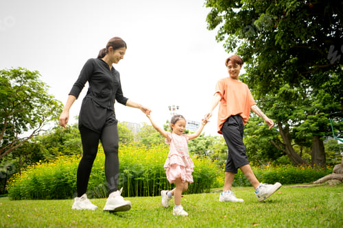 Preview: Parents and daughter stroll through a large flower garden