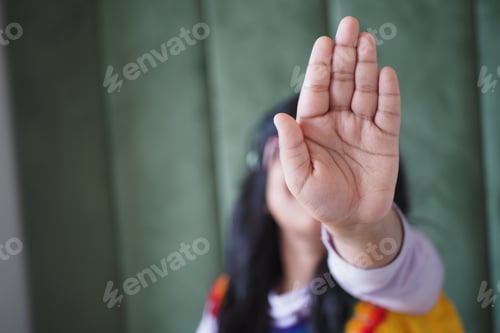 Preview: The Hand Gesture in Focus A Clear Symbol Representing Stop or Refusal in Communication