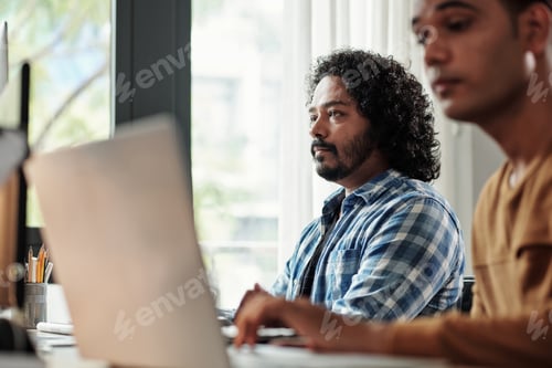 Preview: Pensive Indian Programmer Working