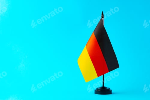 Preview: Small flag of Germany on flagpole close up