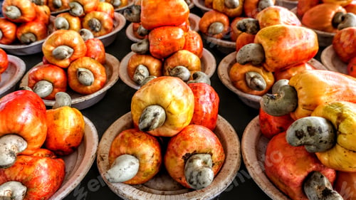 Preview: High angle shot of colorful cashew fruits in a market