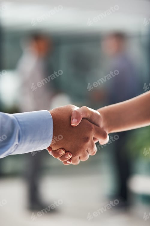 Preview: Sealing the deal with a handshake. Closeup shot of businesspeople shaking hands in an office.