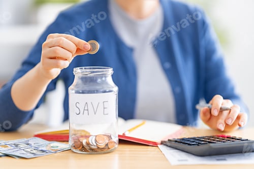 Preview: Saving Money, Woman Putting Coin in Jar