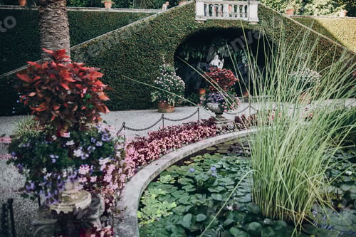 Preview: Old fountain and flowers in botanical garden, on Borromean Islands on Lago Maggiore, Italy