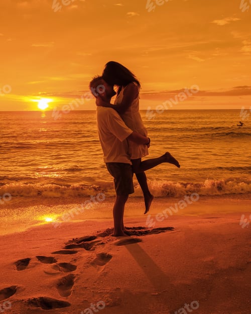 Preview: couple watching sunset on a beach in Phuket Thailand