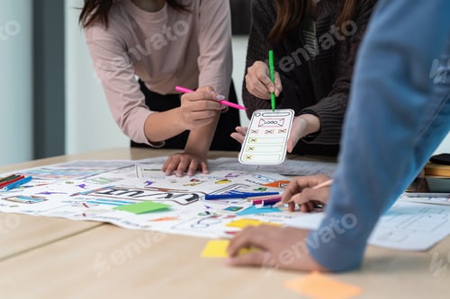 Preview: Team of ux developer and ui designer brainstorming interface wireframe design. Creative digital