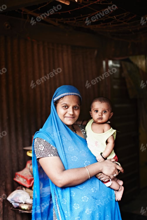 Preview: Smiling woman holding toddler outdoors