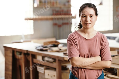 Preview: Female Carpenter Standing in Workshop