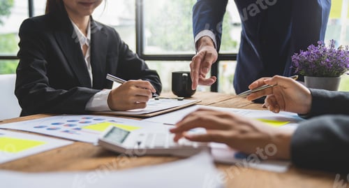 Preview: Business people using pen,tablet,notebook are planning a marketing plan to improve the quality of th