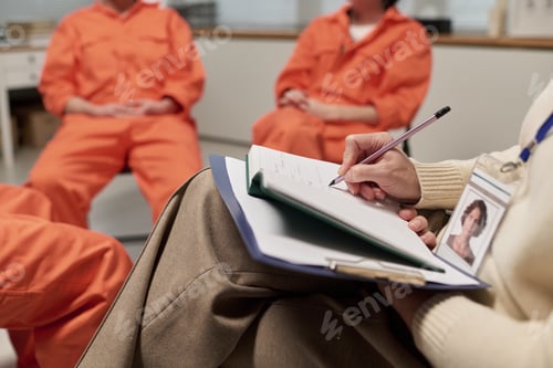 Preview: Middle Aged Woman Taking Notes during Prison Therapy Session