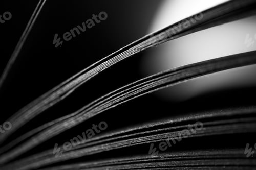 Preview: Black paper sheets with selective focus, close-up. Abstract black and white background