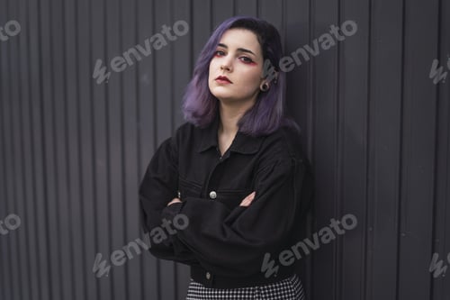 Preview: Spanish woman with purple hair and bright makeup looking sad