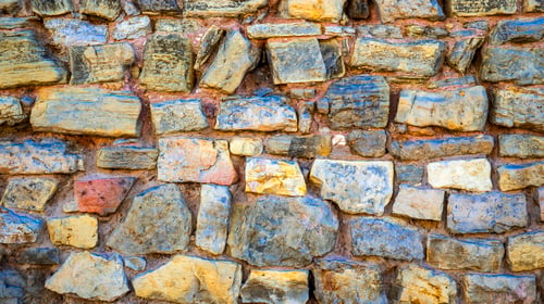 Colorful Stone Wall Background with Varied Shapes