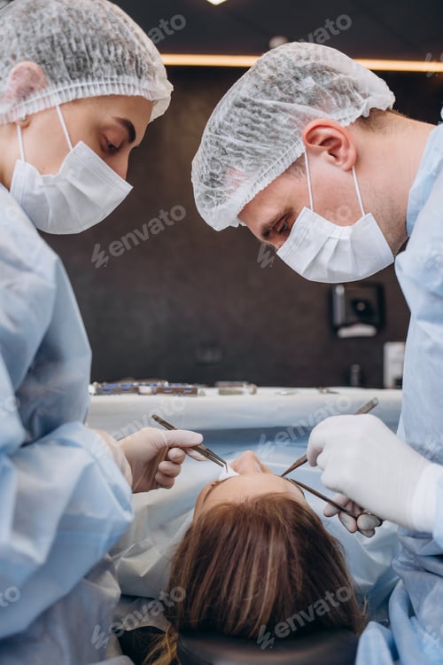 Preview: Medical Team Performing Surgical Operation in Bright Modern Operating Room