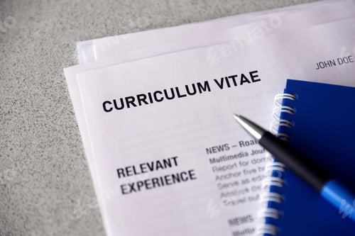 Preview: Top view of stack of office documents including resume and cv forms
