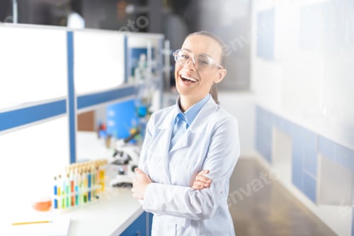 Preview: portrait of cheerful scientist in uniform looking to camera