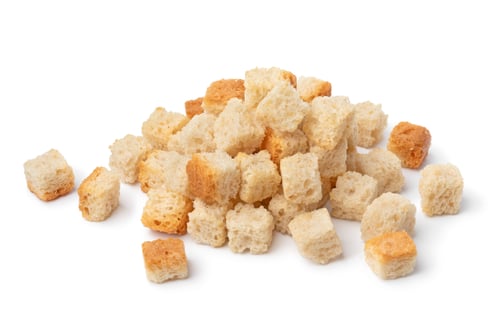 Preview: Heap of fresh natural croutons close up on white background