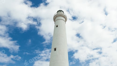 Preview: White tower lighthouse in daylight with clouds