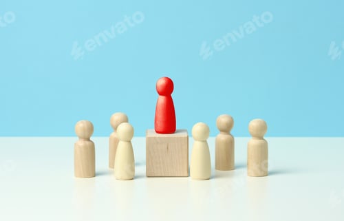 Preview: Wooden figurines of men on a blue background. Public speaking concept, leadership and discussion.