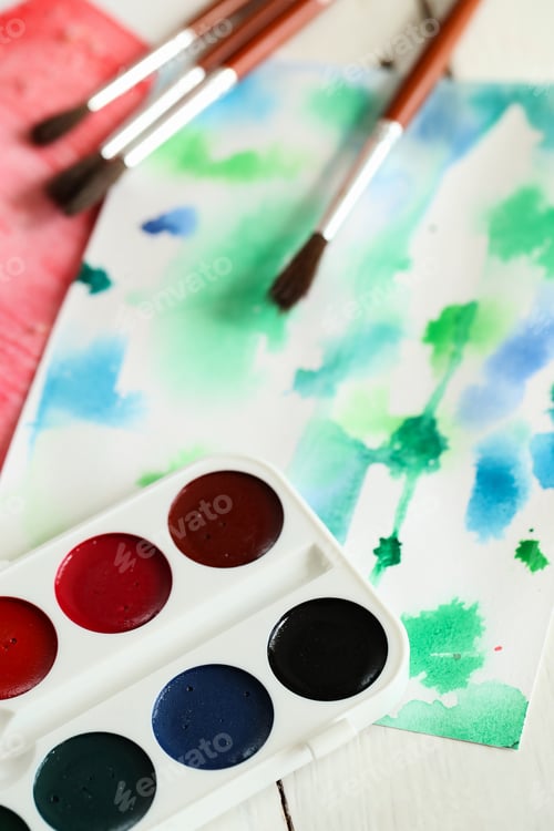 Preview: Watercolor Palette with Brushes and Colorful Abstract Painting