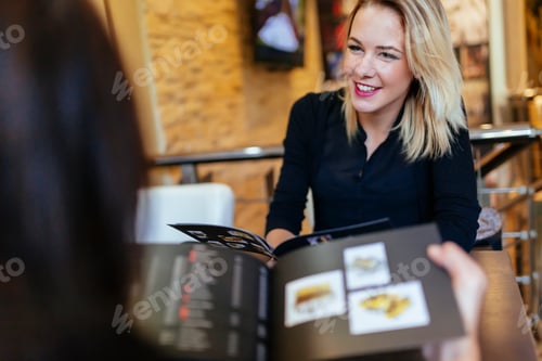 Preview: Two women looking at menu