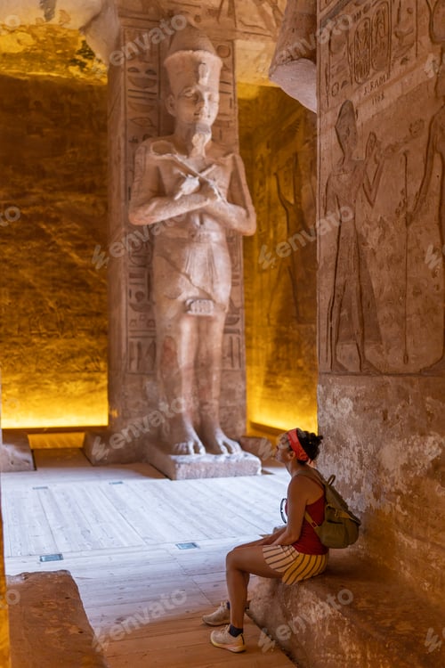 Preview: A woman seated inside an Egyptian temple