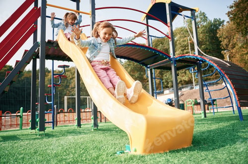 Preview: On the playground slide. Kids are having fun