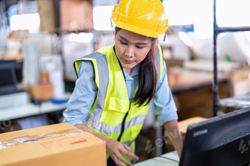 Preview: Worker working in the large depot storage warehouse happy smiling packing box at cashier counter