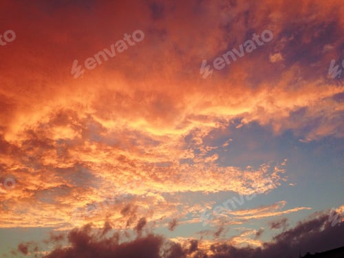 Preview: Fiery sunset with orange and yellow clouds.