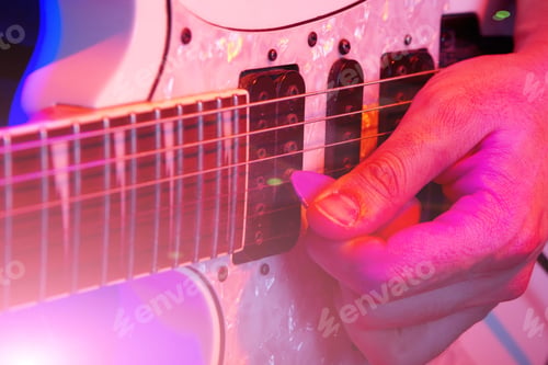Preview: Close-up of the hands of a musician playing an guitar