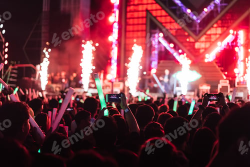 Preview: Crowd of concert stage lights and people fan audience silhouette raising hands or glow stick holding