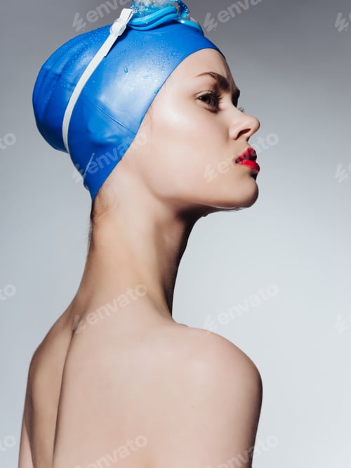 Preview: woman in swimming gear naked shoulders red lips close-up