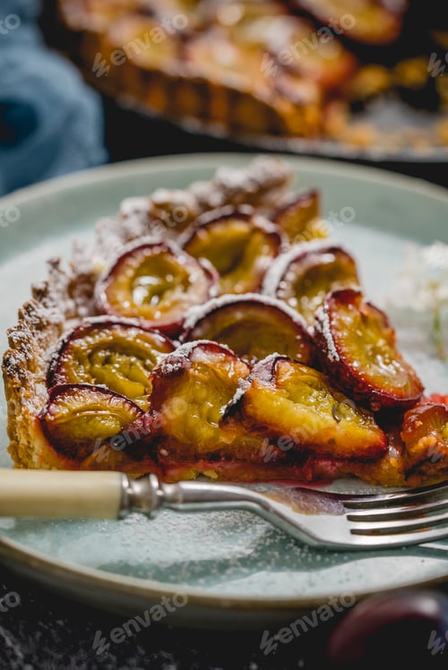 Preview: Close up shot of a sweet plum pie piece served on a plate