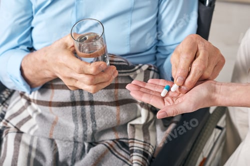 Preview: Taking pills under control of nurse