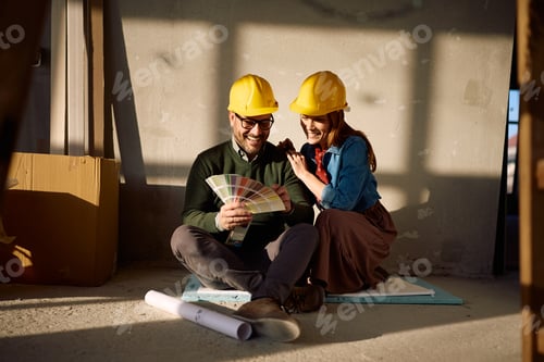 Preview: Happy couple using color pallete while renovating their home.