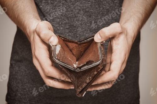 Preview: Close-up of an empty wallet in the hands of a man