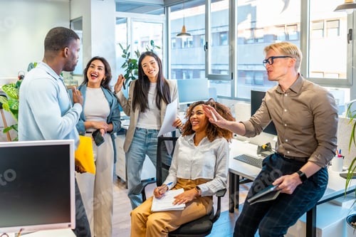 Preview: Multi ethnic business team sharing ideas in coworking office space