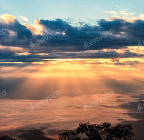 Preview: Golden shining sky over mountain and foggy in the morning at national park