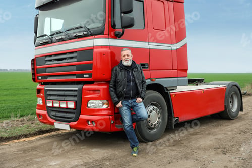 Preview: Portrait of mature driver at modern truck outdoors