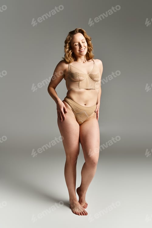 Preview: Sunlit Serenity: Woman in Tan Bodysuit Strikes a Pose